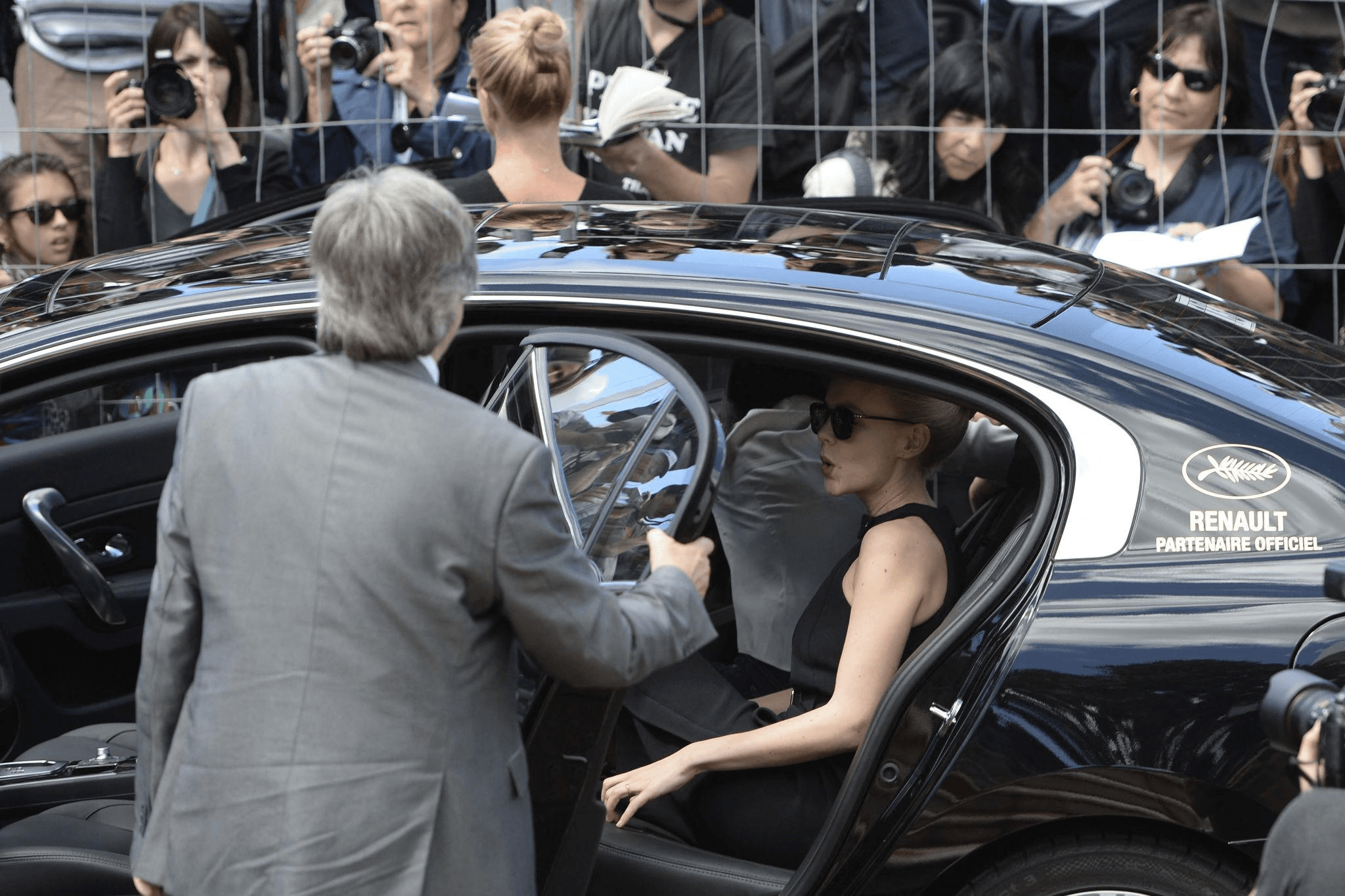 A guest arriving at the Cannes Film Festival in a Renault marked Official Partner