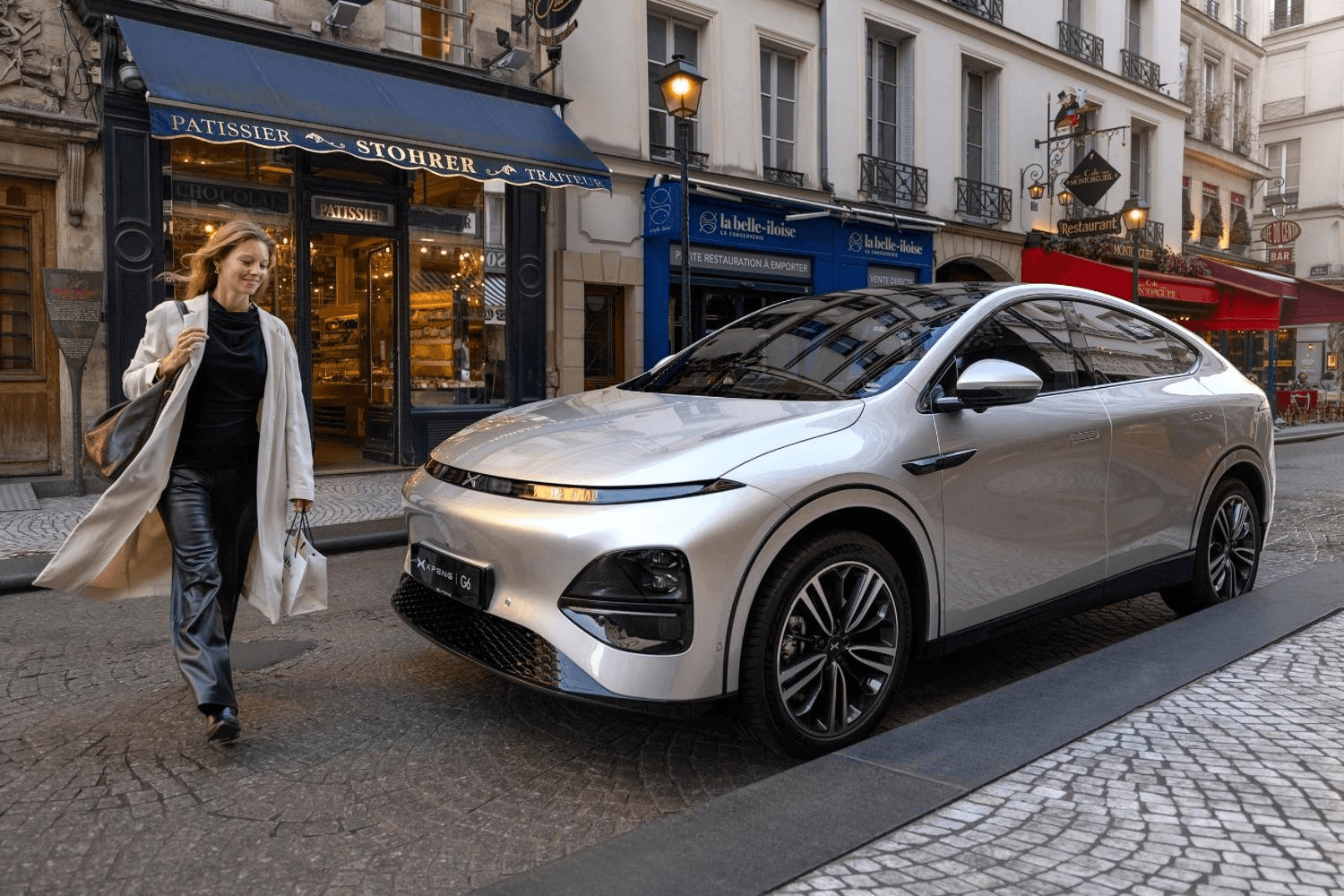 An Xpeng SUV parked on a Paris street