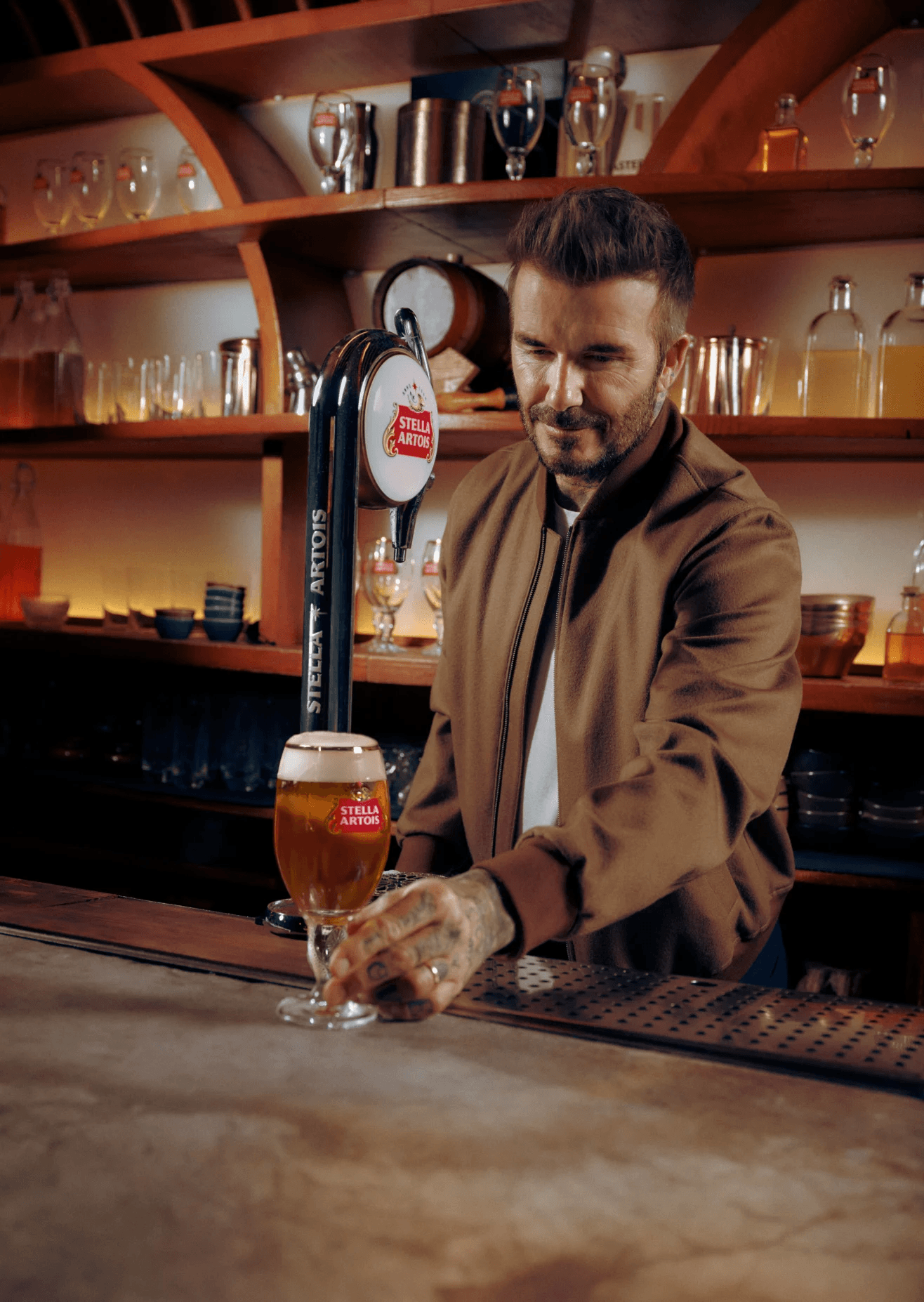 David Beckham for Stella Artois, pouring a beer at a bar