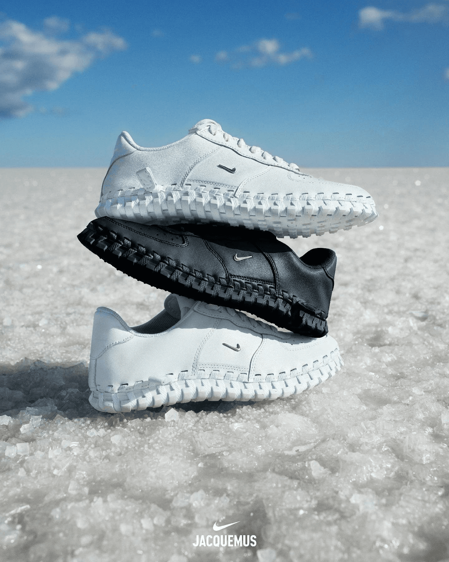 Nike × Jacquemus J Force 1 sneakers stacked on a salt flat